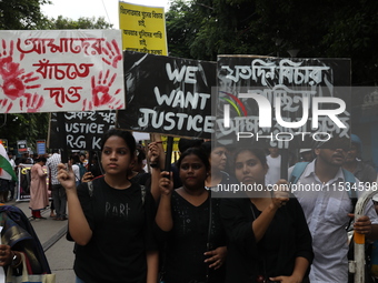 Citizens take part in a protest march in Kolkata, India, on September 1, 2024, against the rape and murder of a PGT doctor. (