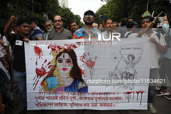 Citizens take part in a protest march in Kolkata, India, on September 1, 2024, against the rape and murder of a PGT doctor. 