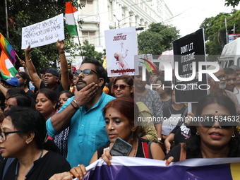 Citizens take part in a protest march in Kolkata, India, on September 1, 2024, against the rape and murder of a PGT doctor. (