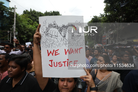 Citizens take part in a protest march in Kolkata, India, on September 1, 2024, against the rape and murder of a PGT doctor. 