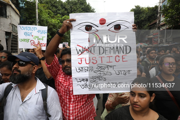 Citizens take part in a protest march in Kolkata, India, on September 1, 2024, against the rape and murder of a PGT doctor. 