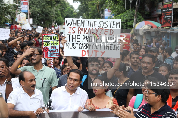 Citizens take part in a protest march in Kolkata, India, on September 1, 2024, against the rape and murder of a PGT doctor. 