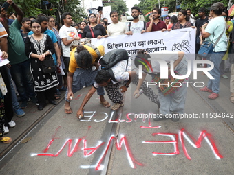 Citizens take part in a protest march in Kolkata, India, on September 1, 2024, against the rape and murder of a PGT doctor. (