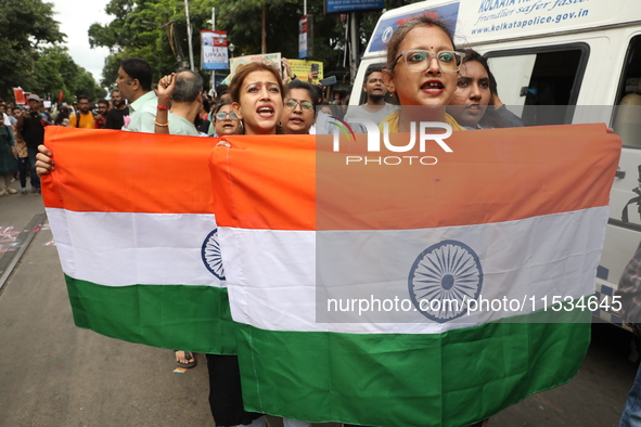 Citizens take part in a protest march in Kolkata, India, on September 1, 2024, against the rape and murder of a PGT doctor. 