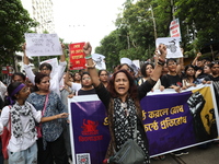 Citizens take part in a protest march in Kolkata, India, on September 1, 2024, against the rape and murder of a PGT doctor. (