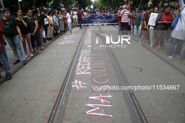 Citizens take part in a protest march in Kolkata, India, on September 1, 2024, against the rape and murder of a PGT doctor. 