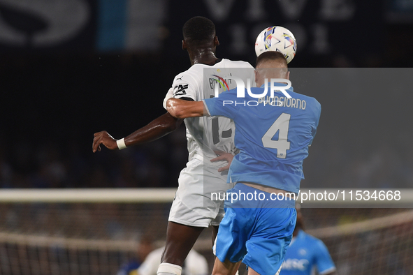 Ange-Yoan Bonny of Parma Calcio competes for the ball with Alessandro Buongiorno of SSC Napoli during the Serie A match between SSC Napoli a...