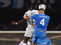 Ange-Yoan Bonny of Parma Calcio competes for the ball with Alessandro Buongiorno of SSC Napoli during the Serie A match between SSC Napoli a...