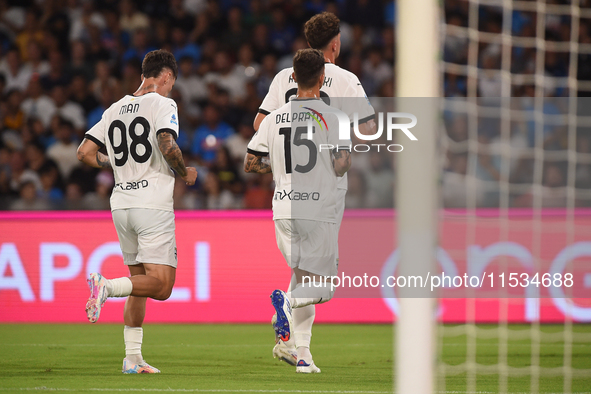 Ange-Yoan Bonny of Parma Calcio celebrates with team mates after scoring during the Serie A match between SSC Napoli and Parma Calcio at Sta...