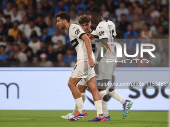 Ange-Yoan Bonny of Parma Calcio celebrates with team mates after scoring during the Serie A match between SSC Napoli and Parma Calcio at Sta...