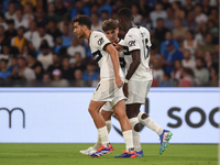 Ange-Yoan Bonny of Parma Calcio celebrates with team mates after scoring during the Serie A match between SSC Napoli and Parma Calcio at Sta...