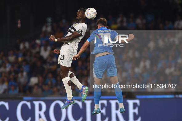 Ange-Yoan Bonny of Parma Calcio competes for the ball with Amir Rrahmani of SSC Napoli during the Serie A match between SSC Napoli and Parma...