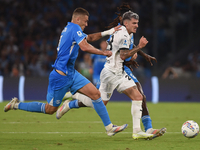 Valentin Mihaila of Parma Calcio competes for the ball with Alessandro Buongiorno of SSC Napoli during the Serie A match between SSC Napoli...