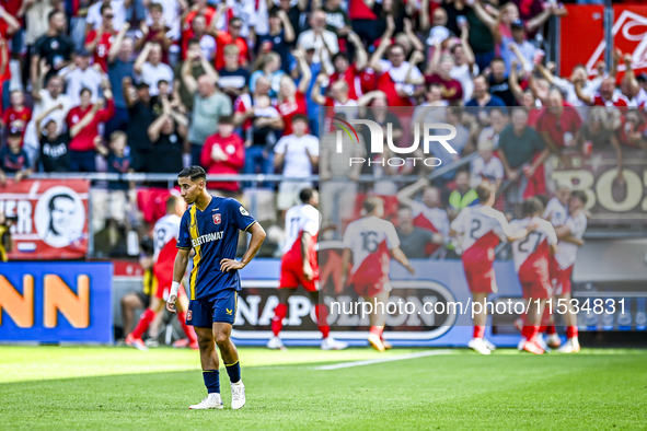 FC Twente's Anass Salah-Eddine is disappointed after FC Utrecht player Can Bozdogan scores the 2-1 goal during the match between Utrecht and...