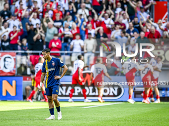 FC Twente's Anass Salah-Eddine is disappointed after FC Utrecht player Can Bozdogan scores the 2-1 goal during the match between Utrecht and...