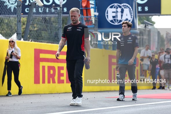 Kevin Magnussen of Haas and Franco Colapinto of Williams before the Formula 1 Italian Grand Prix at Autodromo Nazionale di Monza in Monza, I...