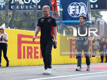 Kevin Magnussen of Haas and Franco Colapinto of Williams before the Formula 1 Italian Grand Prix at Autodromo Nazionale di Monza in Monza, I...