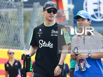 Zhou Guanyu of Kick Sauber and Yuki Tsunoda of RB before the Formula 1 Italian Grand Prix at Autodromo Nazionale di Monza in Monza, Italy on...