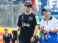 Zhou Guanyu of Kick Sauber and Yuki Tsunoda of RB before the Formula 1 Italian Grand Prix at Autodromo Nazionale di Monza in Monza, Italy on...