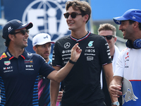 Sergio Perez of Red Bull Racing, George Russell of Mercedes and Daniel Ricciardo of RB before the Formula 1 Italian Grand Prix at Autodromo...