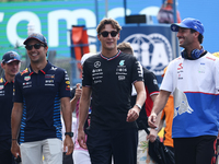 Sergio Perez of Red Bull Racing, George Russell of Mercedes and Daniel Ricciardo of RB before the Formula 1 Italian Grand Prix at Autodromo...