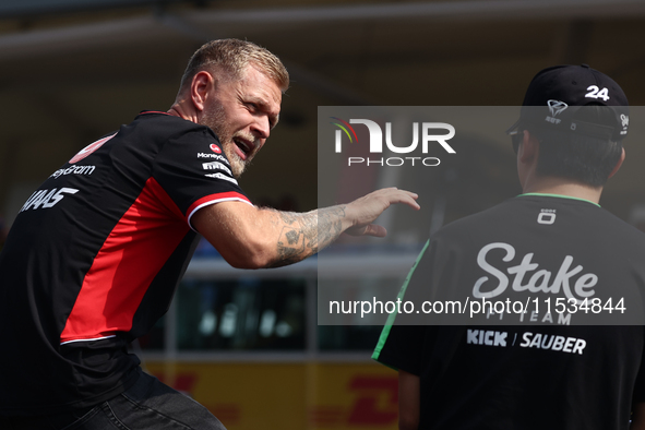 Kevin Magnussen of Haas and Zhou Guanyu of Kick Sauber before the Formula 1 Italian Grand Prix at Autodromo Nazionale di Monza in Monza, Ita...