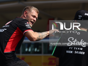 Kevin Magnussen of Haas and Zhou Guanyu of Kick Sauber before the Formula 1 Italian Grand Prix at Autodromo Nazionale di Monza in Monza, Ita...