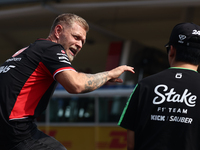 Kevin Magnussen of Haas and Zhou Guanyu of Kick Sauber before the Formula 1 Italian Grand Prix at Autodromo Nazionale di Monza in Monza, Ita...