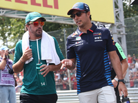 Fernando Alonso of Aston Martin Aramco and Sergio Perez of Red Bull Racing before the Formula 1 Italian Grand Prix at Autodromo Nazionale di...