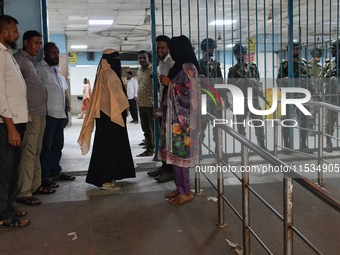 Bangladesh army personnel stand guard at Dhaka Medical College Hospital as medical services in the emergency department remain suspended in...