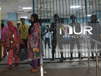 Bangladesh army personnel stand guard at Dhaka Medical College Hospital as medical services in the emergency department remain suspended in...