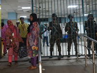 Bangladesh army personnel stand guard at Dhaka Medical College Hospital as medical services in the emergency department remain suspended in...