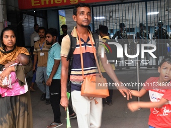 Bangladesh army personnel stand guard at Dhaka Medical College Hospital as medical services in the emergency department remain suspended in...