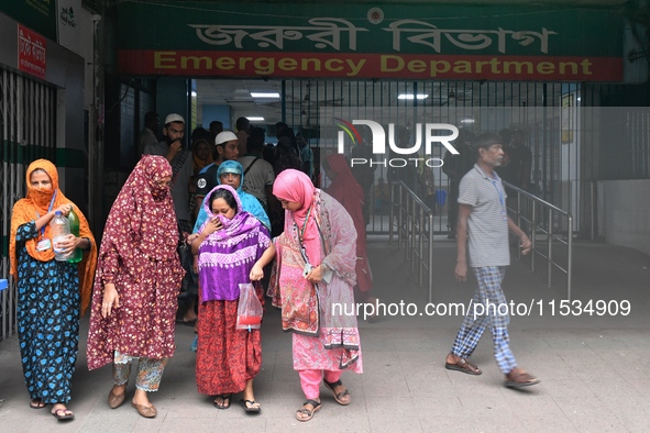 Bangladesh army personnel stand guard at Dhaka Medical College Hospital as medical services in the emergency department remain suspended in...