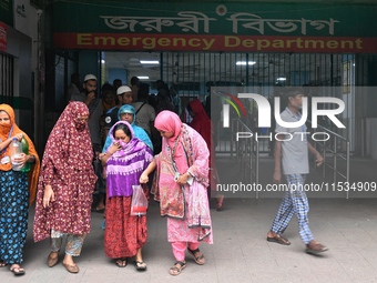 Bangladesh army personnel stand guard at Dhaka Medical College Hospital as medical services in the emergency department remain suspended in...