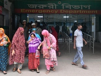 Bangladesh army personnel stand guard at Dhaka Medical College Hospital as medical services in the emergency department remain suspended in...