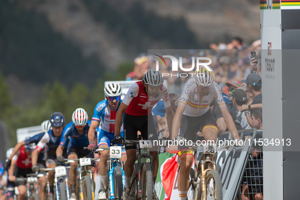 Cyclists participate in the UCI Mountain Bike World Championships Men in Pal Arinsal, Andorra, on September 1, 2024. 