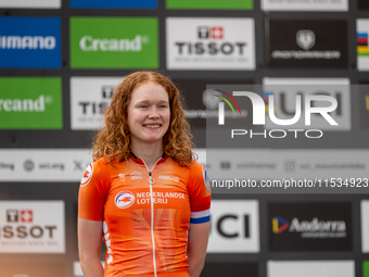 Puck Pieterse of the Netherlands stands on the podium at the UCI Mountain Bike World Championships Women in Pal Arinsal, Andorra, on Septemb...