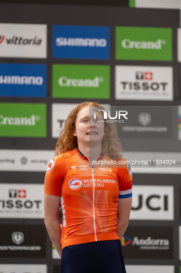 Puck Pieterse of the Netherlands stands on the podium at the UCI Mountain Bike World Championships Women in Pal Arinsal, Andorra, on Septemb...