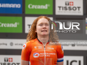 Puck Pieterse of the Netherlands stands on the podium at the UCI Mountain Bike World Championships Women in Pal Arinsal, Andorra, on Septemb...