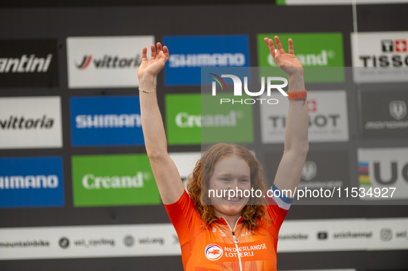 Puck Pieterse of the Netherlands stands on the podium at the UCI Mountain Bike World Championships Women in Pal Arinsal, Andorra, on Septemb...