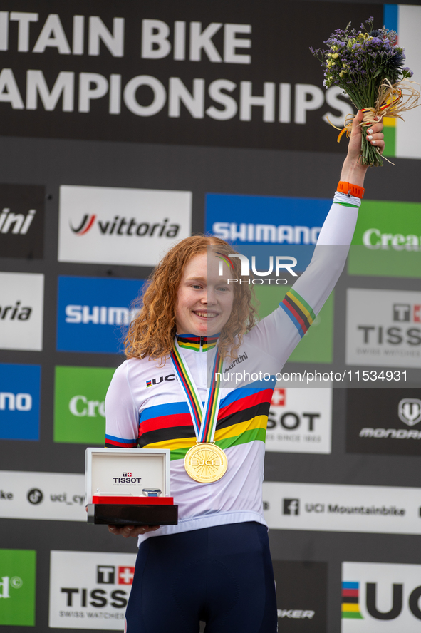 Puck Pieterse of the Netherlands stands on the podium at the UCI Mountain Bike World Championships Women in Pal Arinsal, Andorra, on Septemb...