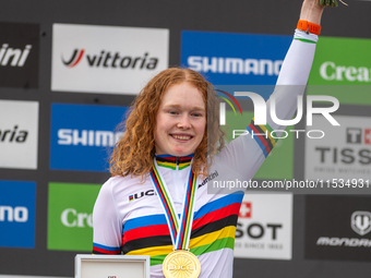 Puck Pieterse of the Netherlands stands on the podium at the UCI Mountain Bike World Championships Women in Pal Arinsal, Andorra, on Septemb...