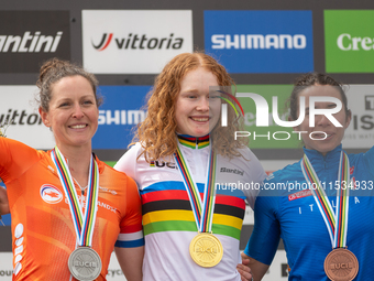 Anne Terpstra of the Netherlands, Martina Berta of Italy, and Puck Pieterse of the Netherlands stand on the podium at the UCI Mountain Bike...