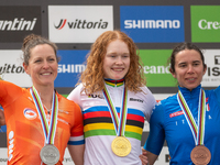 Anne Terpstra of the Netherlands, Martina Berta of Italy, and Puck Pieterse of the Netherlands stand on the podium at the UCI Mountain Bike...