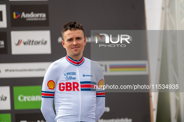 Thomas Pidcock of Great Britain stands on the podium at the UCI Mountain Bike World Championships Men Under 23 Race in Pal Arinsal, Andorra,...