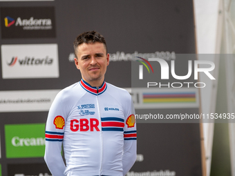 Thomas Pidcock of Great Britain stands on the podium at the UCI Mountain Bike World Championships Men Under 23 Race in Pal Arinsal, Andorra,...