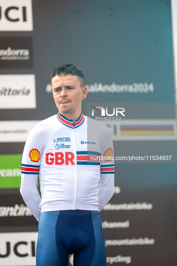 Thomas Pidcock of Great Britain stands on the podium at the UCI Mountain Bike World Championships Men Under 23 Race in Pal Arinsal, Andorra,...