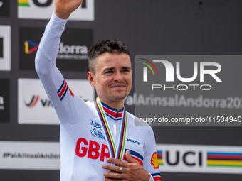 Thomas Pidcock of Great Britain stands on the podium at the UCI Mountain Bike World Championships Men Under 23 Race in Pal Arinsal, Andorra,...