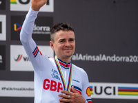 Thomas Pidcock of Great Britain stands on the podium at the UCI Mountain Bike World Championships Men Under 23 Race in Pal Arinsal, Andorra,...